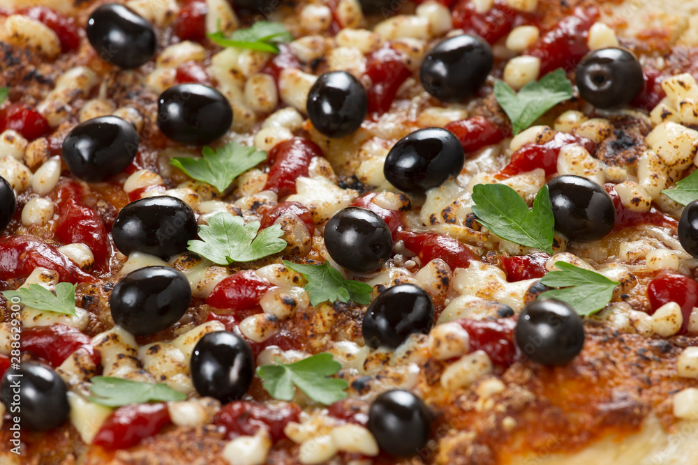 Close up pizza with olives and herbs Close up pizza with olives and herbs
