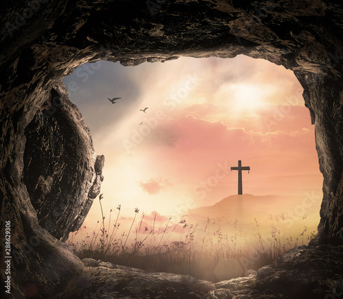 Konstfotografi Empty tomb with stone rolled away and cross on a hill at sunrise background, res