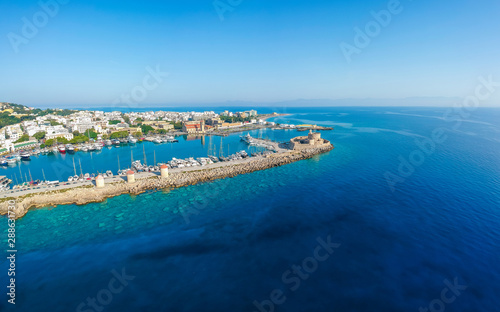 Aerial birds eye view drone photo of Rhodes city island  Dodecanese  Greece. Panorama with Mandraki port  lagoon and clear blue water. Famous tourist destination in South Europe