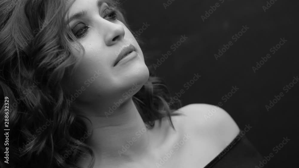 Brunette posing on camera. Black and white video. Emotions girls with a slight flirtation. Brunette posing on camera. Black and white video. Emotions girls with a slight flirtation.