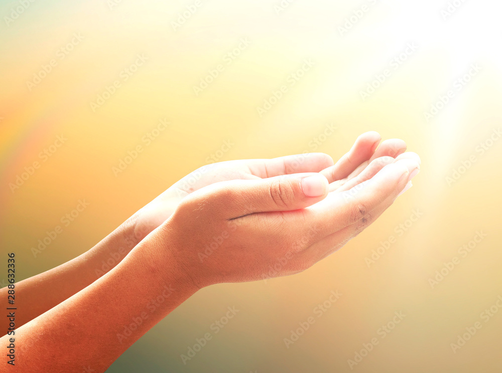 Thanksgiving concept: Mercy person open empty two hands and palm up for pray and worship to God on blur background