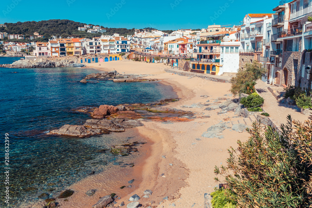 Sea landscape with Calella de Palafrugell, Catalonia, Spain near of Barcelona. Scenic fisherman village with nice sand beach and clear blue water in nice bay. Famous tourist destination in Costa Brava