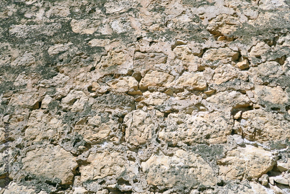 Détail de mur de pierre ancien.