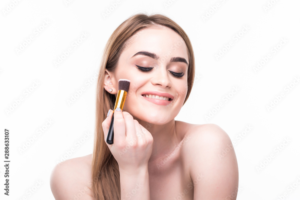 Beautiful woman with makeup brushes near her face isolated on white background Beautiful woman with makeup brushes near her face isolated on white background