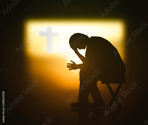 Hope concept: Christian praying for waiting holy spirit over blurred cross of Jesus Christ in dark room background