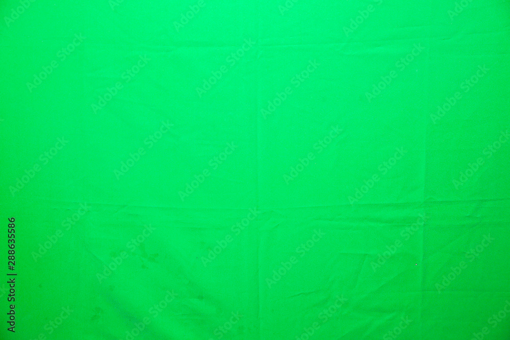 Green material background. Texture of cloth. Green material background. Texture of cloth.