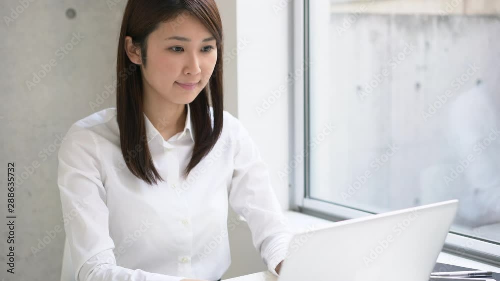Young business woman working at office