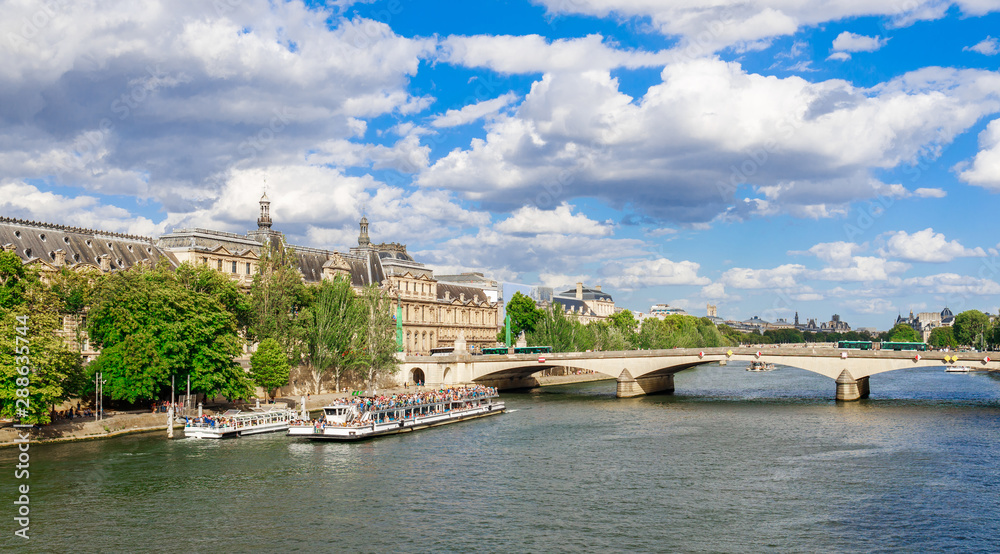 Panoramic cityscape of Seine river and Paris, France, Europe. Seine is famous tourist destination with many landmarks. View of Seine postcard in Paris