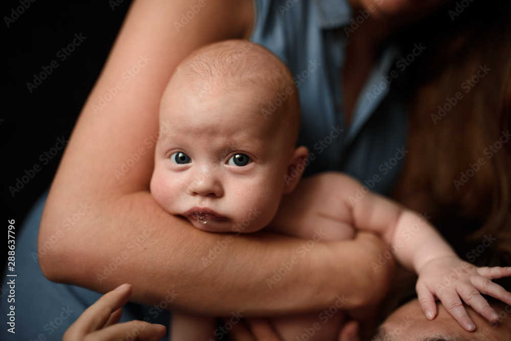 Young parents have fun with their little son Young parents have fun with their little son