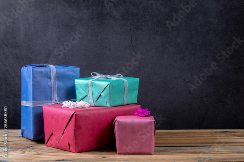 Christmas present boxes on a dark background. Free space for text, copy space