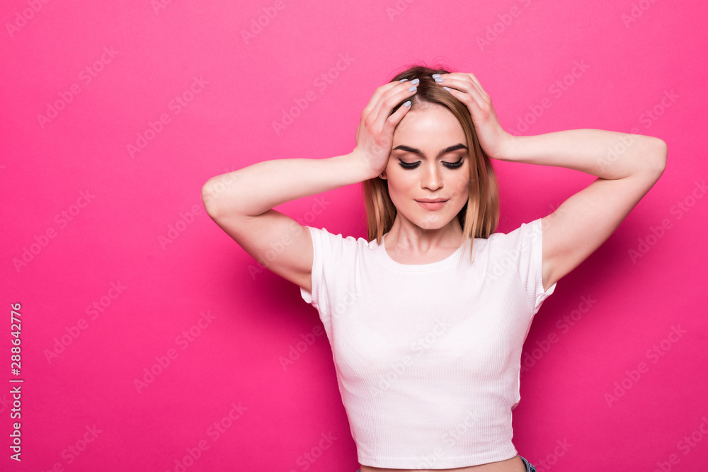 Concept of sales on Black Friday and consumerism. Close up portrait of happy cheerful excited surprised woman standing against pink background Concept of sales on Black Friday and consumerism. Close up portrait of happy cheerful excited surprised woman standing against pink background