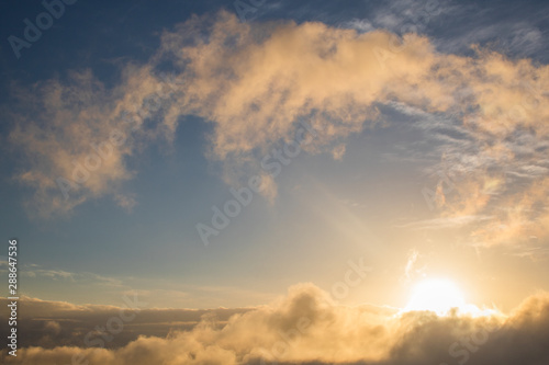 Wallpaper Mural Golden blue sunset or sunrise with low clouds over the ocean. Torontodigital.ca
