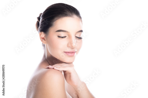 Beauty woman face isolate in white background. Young caucasian girl  perfect skin  cosmetic  spa  beauty treatment concept. Side shot  hand on shoulder  close eye  smile.
