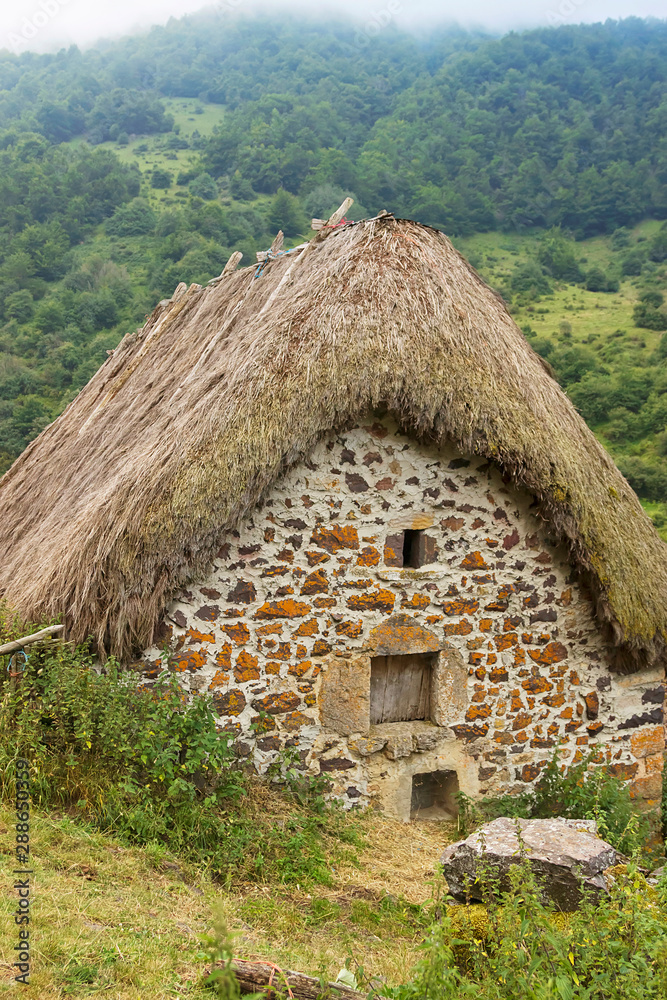 La Pornacal hiking route in Somiedo natural park, Spain, with straw roof houses