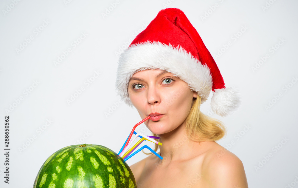 Watermelon dietary detox beverage. Woman enjoy detox drink. Health care and dieting. Girl attractive nude wear santa hat drink juice watermelon cocktail straw white background. Winter detox concept Watermelon dietary detox beverage. Woman enjoy detox drink. Health care and dieting. Girl attractive nude wear santa hat drink juice watermelon cocktail straw white background. Winter detox concept