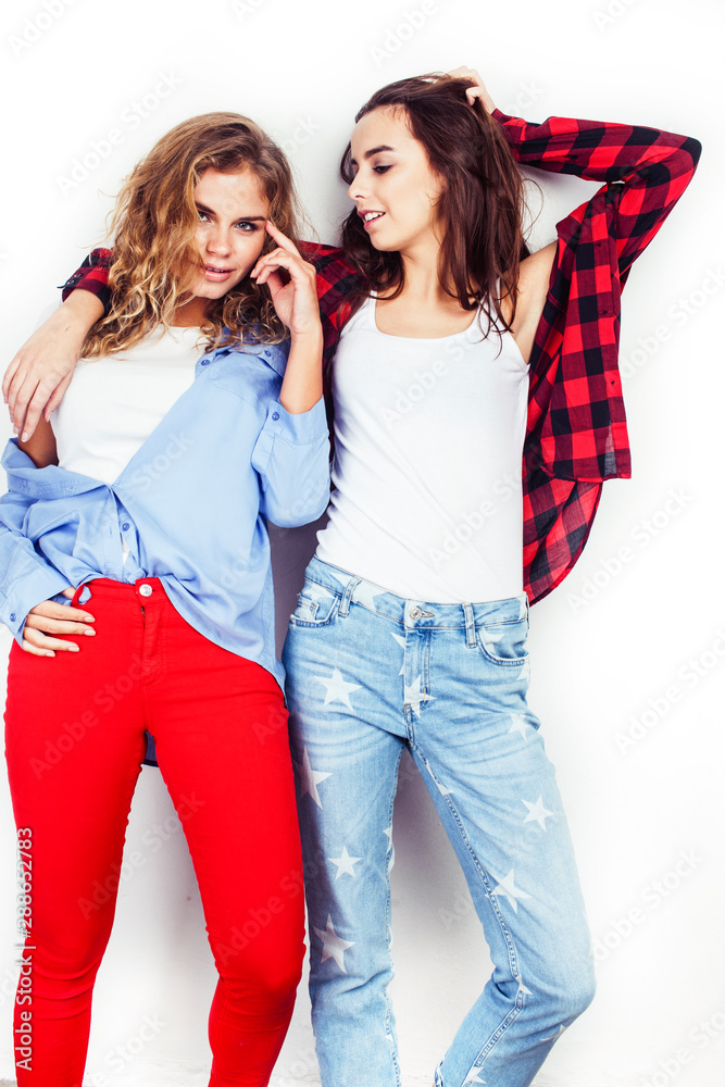 best friends teenage girls together having fun, posing emotional on white background, besties happy smiling, lifestyle people concept