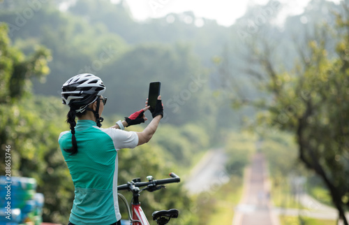Photography Riding on bike path, taking pictures with smartphone while riding bike on sunny