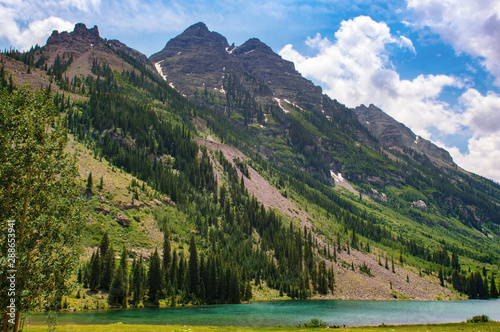 Maroon Bells Lake  in the summer. White River National Forest and Maroon Bells mountain range  in the background. © Kristin Greenwood