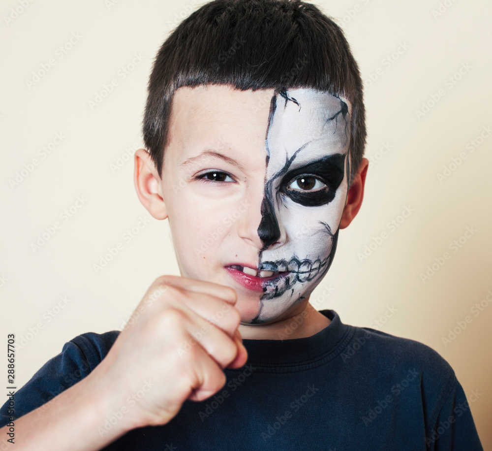 little cute boy with face paint like skeleton to celebrate halloween, lifestyle people concept little cute boy with face paint like skeleton to celebrate halloween, lifestyle people concept