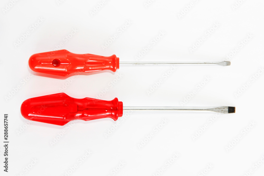 two old rusty metal screwdrivers with red a handles two old rusty metal screwdrivers with red a handles