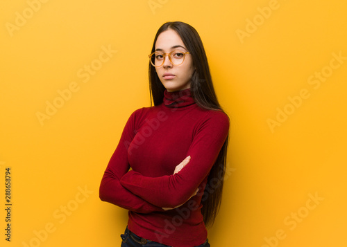Bilde på lerret Intellectual young girl looking straight ahead