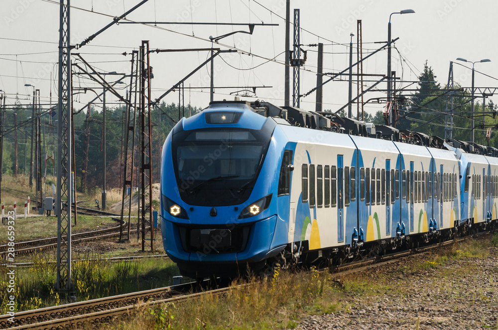 ELECTRIC MULTIPLE UNIT - Modern passenger train on the railway route