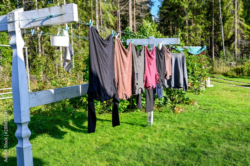 clothes hanging to dry outdoors on a clothesline