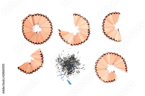 Wooden spiral pencil shavings from sharpener set and collection isolated on white background, top view