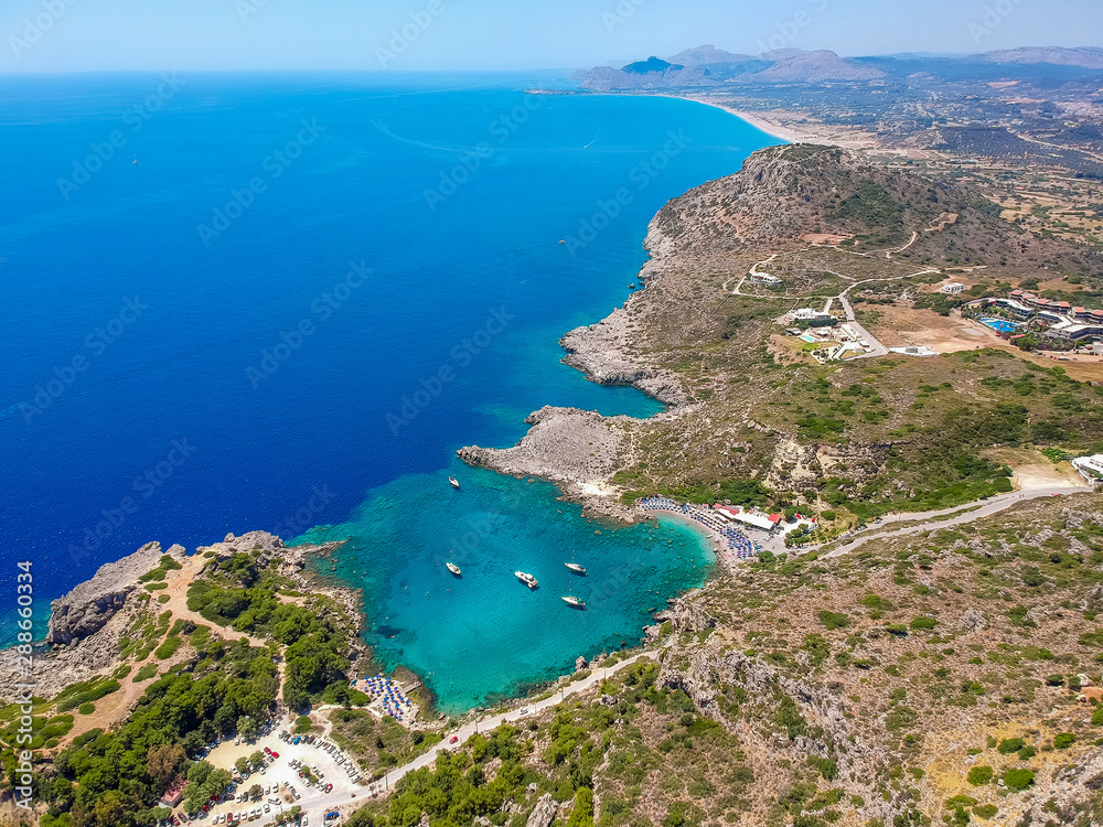 Aerial birds eye view drone photo Ladiko bay near Anthony Quinn on Rhodes island, Dodecanese, Greece. Panorama with nice lagoon and clear blue water. Famous tourist destination in South Europe