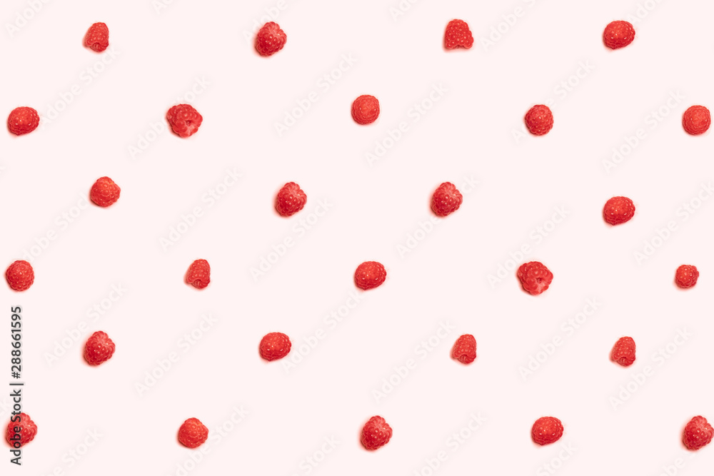 Pattern of ripe raspberries on a pink background. Can be used for blog, poster or web banner.