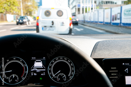 Car with adaptive cruise control (ACC) following and stopping behind another one