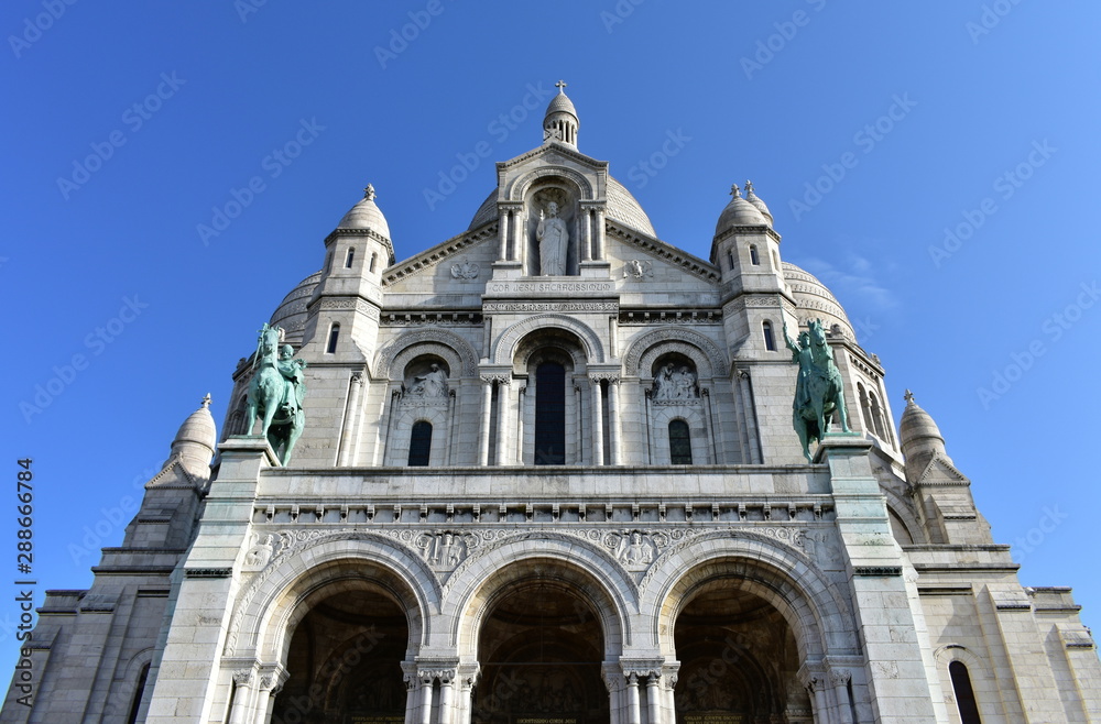 Basilique du Sacre Coeur with blue sky. Paris, France.