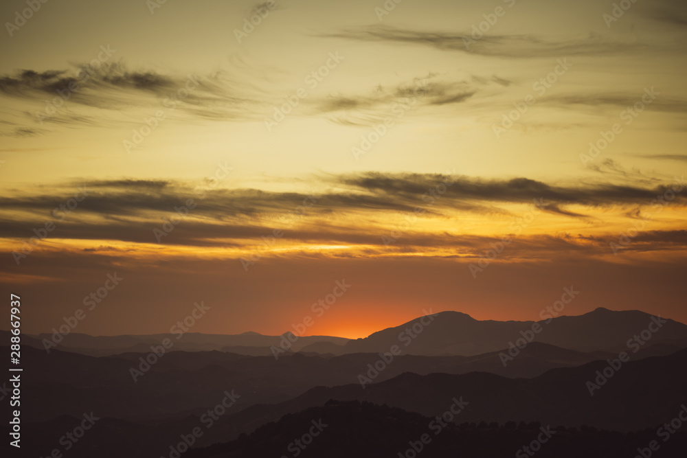 Beautiful sky on yellow shades with mountains