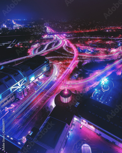 Stadtansicht von Berlin bei Nacht mit Verkehrslichtern photo
