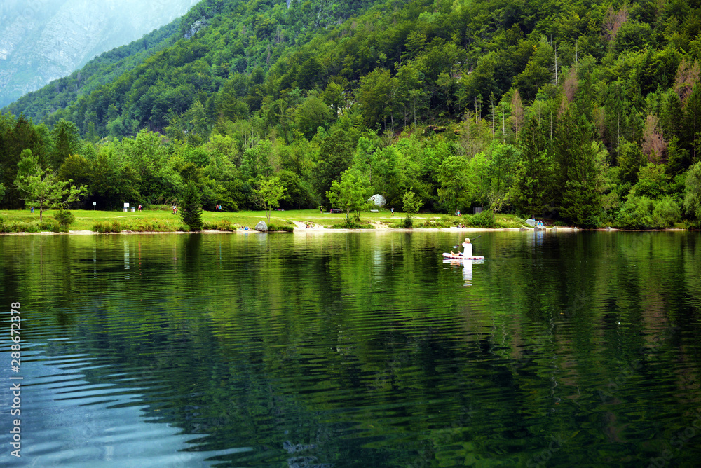 Panoramic view of Lake Bohinj, the largest permanent lake in Slovenia. It is located within the Bohinj Valley of the Julian Alps