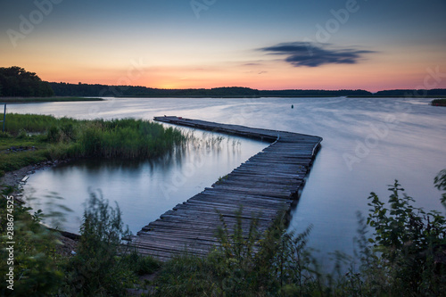Footbridge on Lake Kirsajty during the sunset, Masuria, Poland