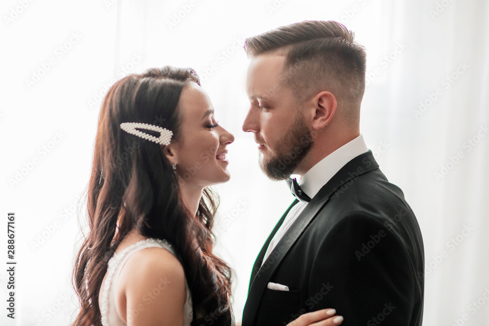 close up. happy bride and groom looking at each other