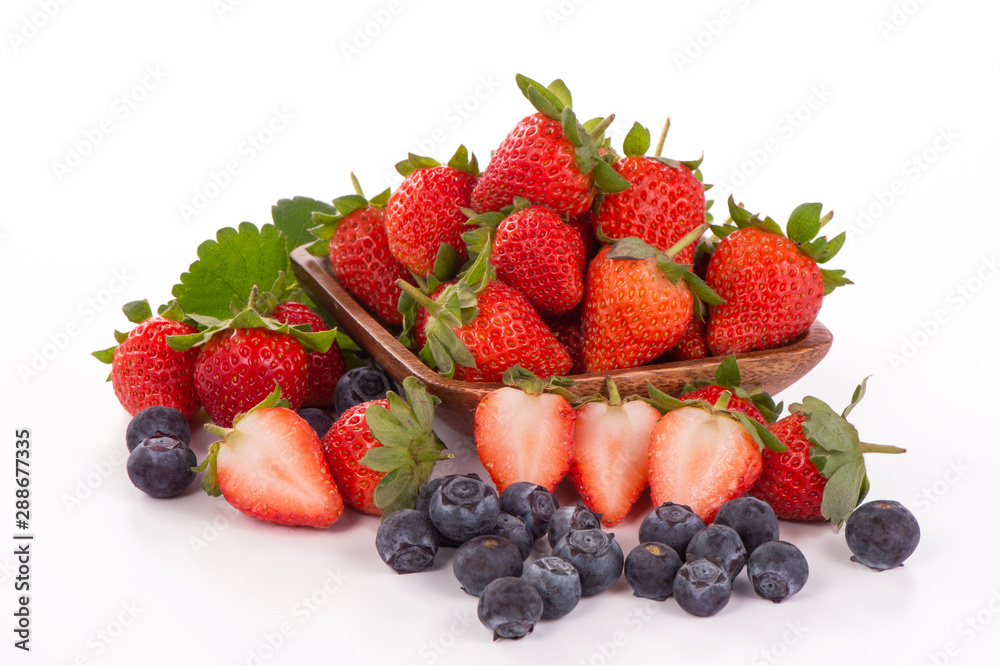 A bowl set of beautiful and delicious strawberry and blueberry isolated on white background, close up, copy space, clipping path, cut out. A bowl set of beautiful and delicious strawberry and blueberry isolated on white background, close up, copy space, clipping path, cut out.