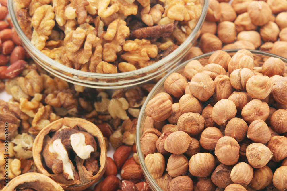 Different nuts in glass cups Different nuts in glass cups