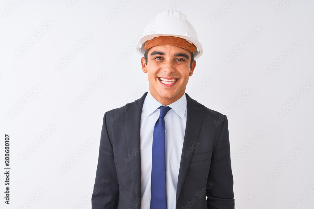 Young handsome architect man wearing suit and helmet over isolated white background with a happy and cool smile on face. Lucky person.