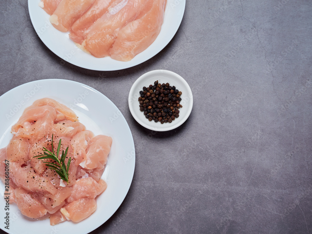 Fresh chicken tenderloin on stone table top Fresh chicken tenderloin on stone table top
