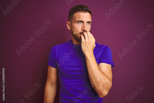 Young man wearing casual purple t-shirt over lilac isolated background looking stressed and nervous with hands on mouth biting nails. Anxiety problem.