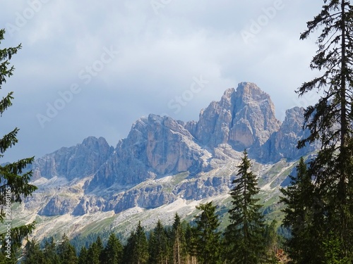 The "Roda di Vael", one of the peaks of the Dolomites of the Catinaccio / Rosengarten massif seen from the woods of Trentino, near the village of Carenzza, Italy - August 2019.