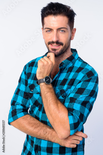 Portrait of young handsome bearded hipster man