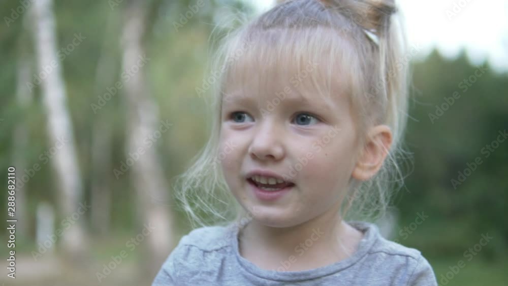 Close-up of the face of a little beautiful girl in the forest. Close-up of the face of a little beautiful girl in the forest.
