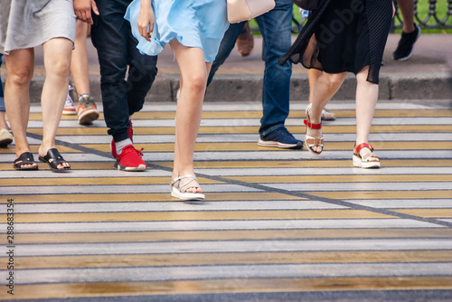 feet of pedestrians at a pedestrian crossing