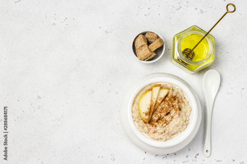 Fototapeta premium Spiced cinnamon apple pie porridge. Top view, space for text.