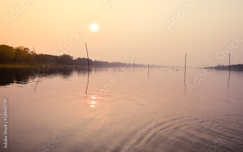 Beautiful Sunset scene On Lake water surface natural composition. Sunset over lake