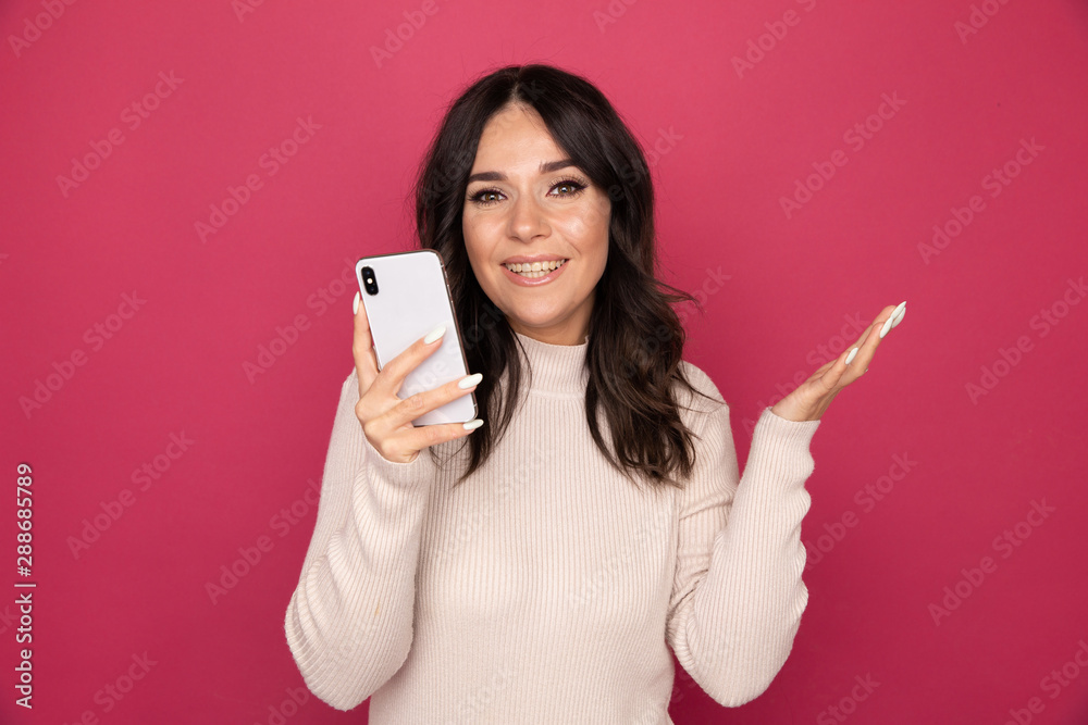 Woman with happy face holding phone and getting good news isolated Woman with happy face holding phone and getting good news isolated