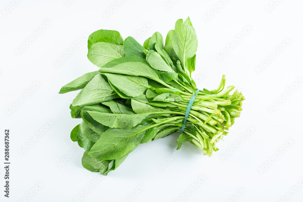 Obraz premium a handful of fresh green cabbage on a white background